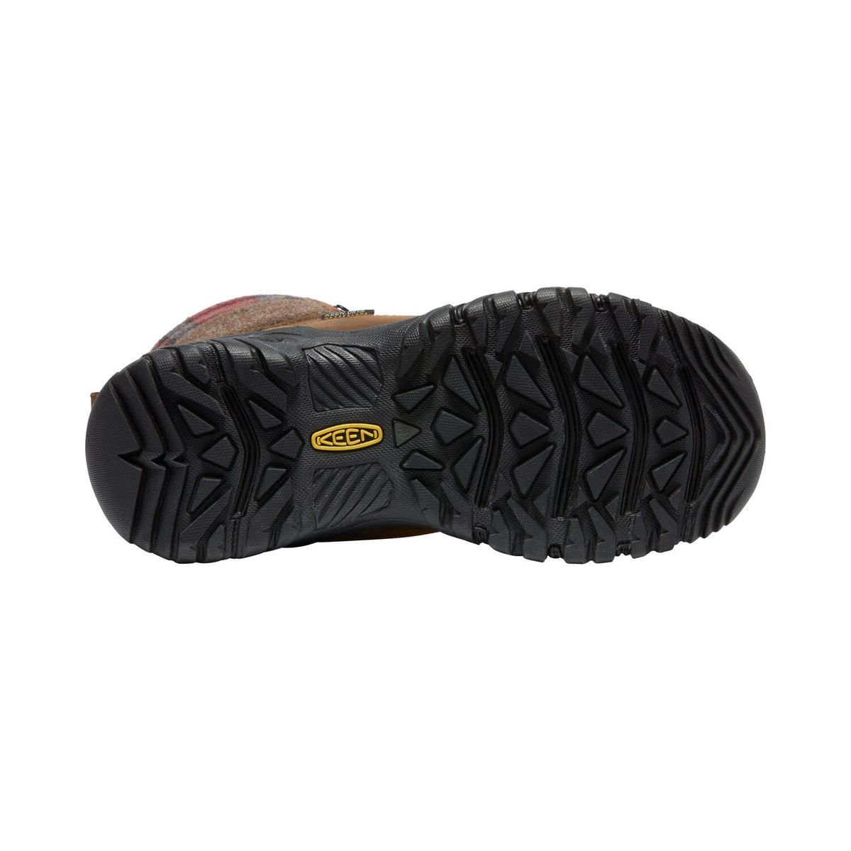 The image shows the bottom view of the KEEN GRETA TALL BOOT BROWN - WOMENS, showcasing its thick, rugged black sole with a yellow Keen logo in the center. This highlights its qualities as an insulated boot perfect for winter adventures.