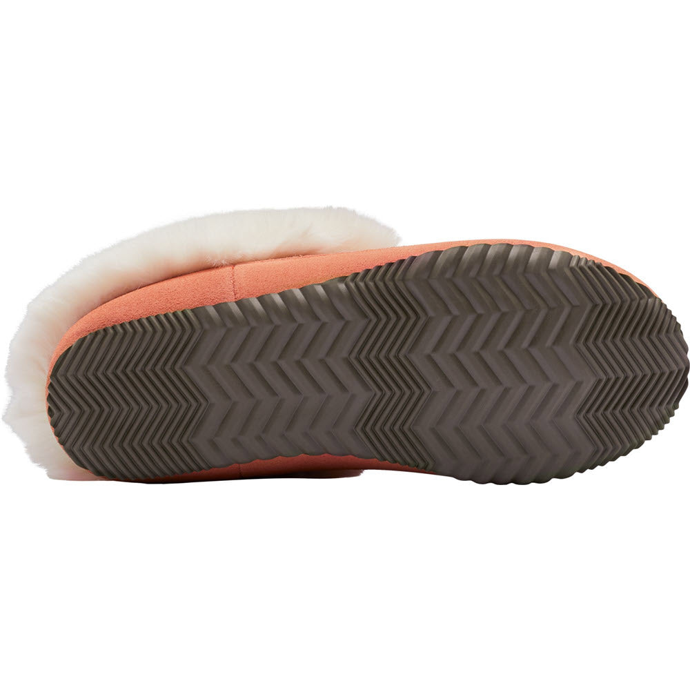 Bottom view of the SOREL GO COFFEE RUN PARADOX PINK - WOMENS boot by Sorel, featuring a thick rubber sole and white fur lining. This luxuriously soft slipper boasts a zigzag tread pattern for traction, making it perfect for quick trips outside.