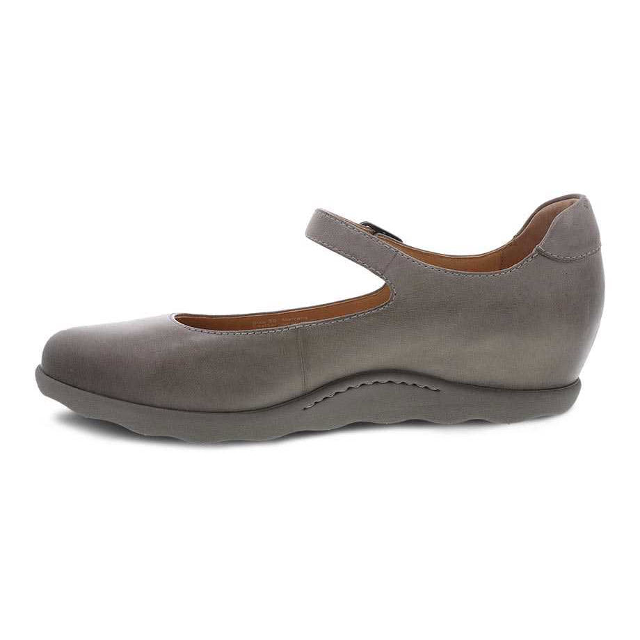 Side view of a single taupe burnished DANSKO MARCELLA shoe for women, featuring a thick sole, a strap across the upper, and a hidden wedge heel with Dansko Natural Arch technology.