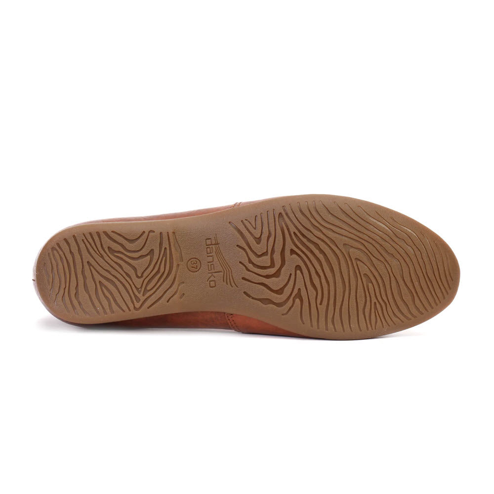 The image shows the sole of the DANSKO LARISA SADDLE - WOMENS, featuring a wave-like tread pattern and complemented by brown leather uppers from Dansko.