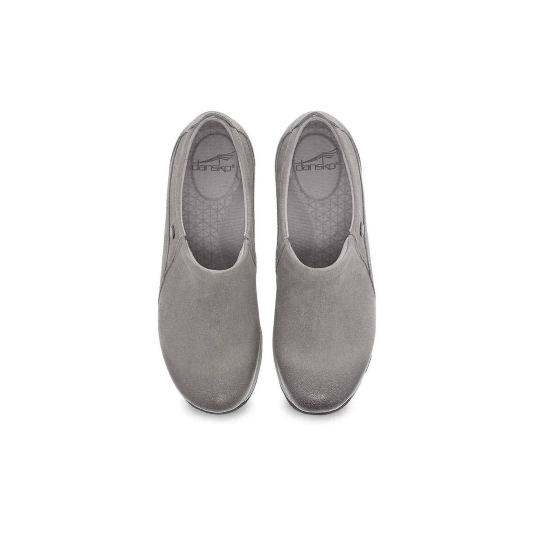 A pair of Dansko&#39;s DANSKO PATTI TAUPE BURNISHED slip-on shoes for women, showcasing a gray color with a rounded toe design and slip-resistant sole, viewed from above on a plain white background.