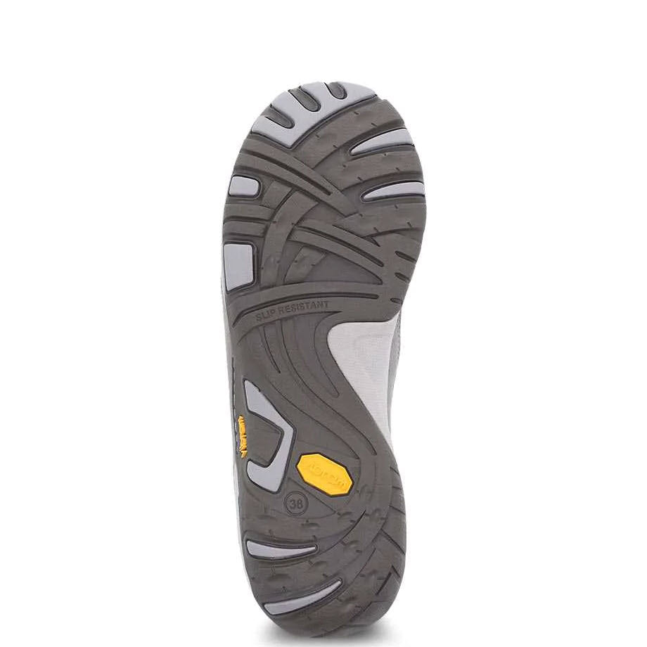 The image showcases the slip-resistant tread pattern on the sole of the DANSKO PATTI TAUPE BURNISHED - WOMENS shoe by Dansko, which features grey with black and yellow accents, making it perfect for outdoor activities.