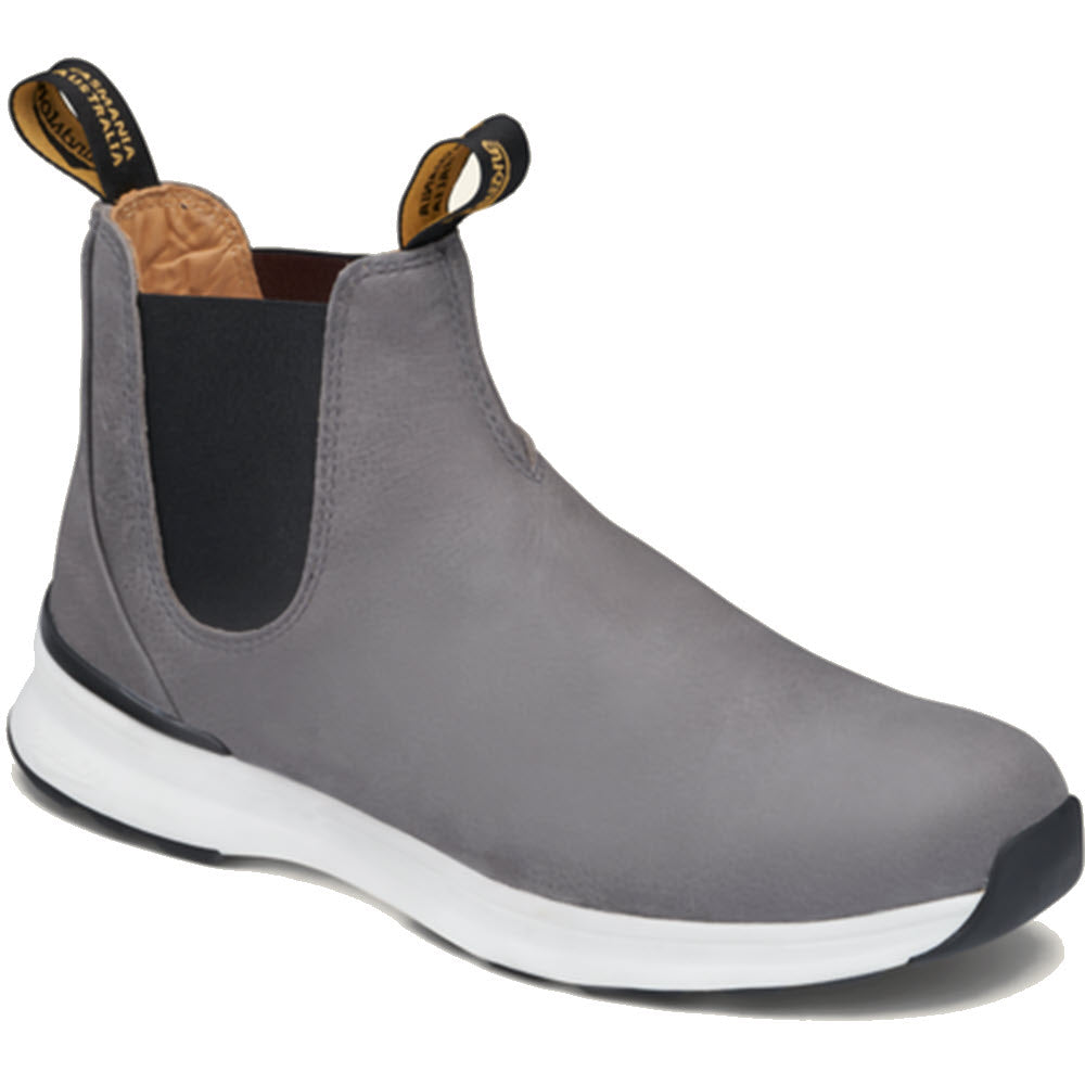 The BLUNDSTONE ACTIVE DUSTY GREY - WOMENS by Blundstone is a gray slip-on shoe featuring black elastic side panels, a white and black sole, and black pull tabs on the heel and tongue, designed for lightweight breathable comfort.