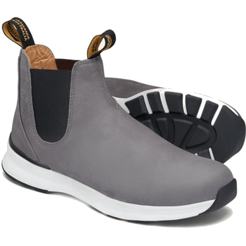 The Blundstone Active Dusty Grey Women&#39;s boots feature gray, slip-on ankle design with black elastic side panels and white soles, crafted from waterproof suede leather for lightweight breathable comfort.