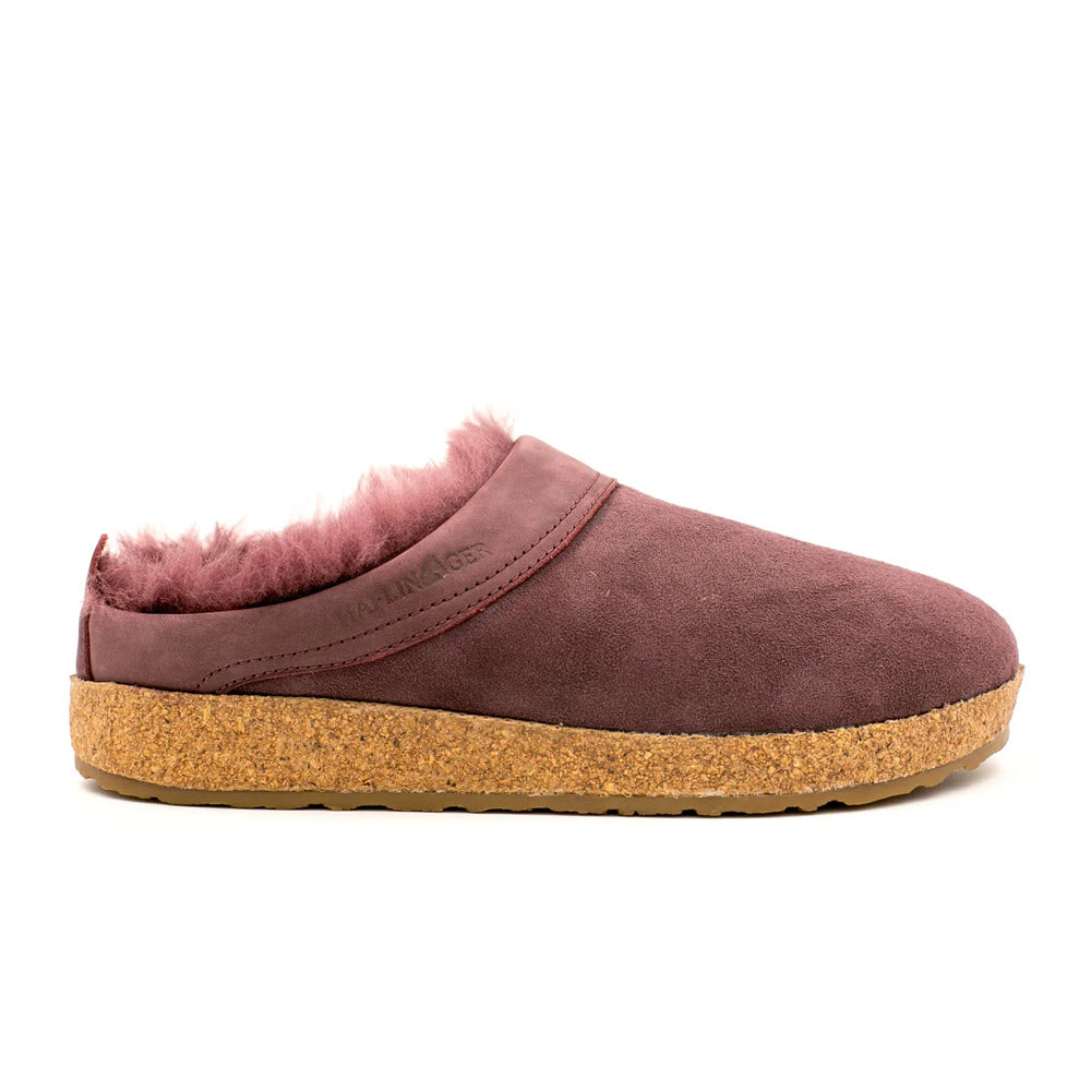 The Haflingers Snowbird Mauve – Women’s is a mauve-colored suede slipper featuring a cork footbed and plush lining, reminiscent of the classic Haflinger Snowbird clogs.