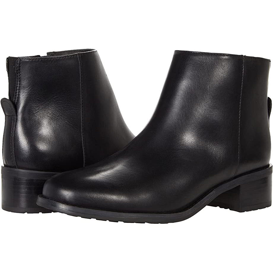 A pair of DAVID TATE VOYAGE BLACK ankle booties from David Tate, featuring black leather, low heels, and convenient side zippers, displayed against a white background to give your style that added boost.