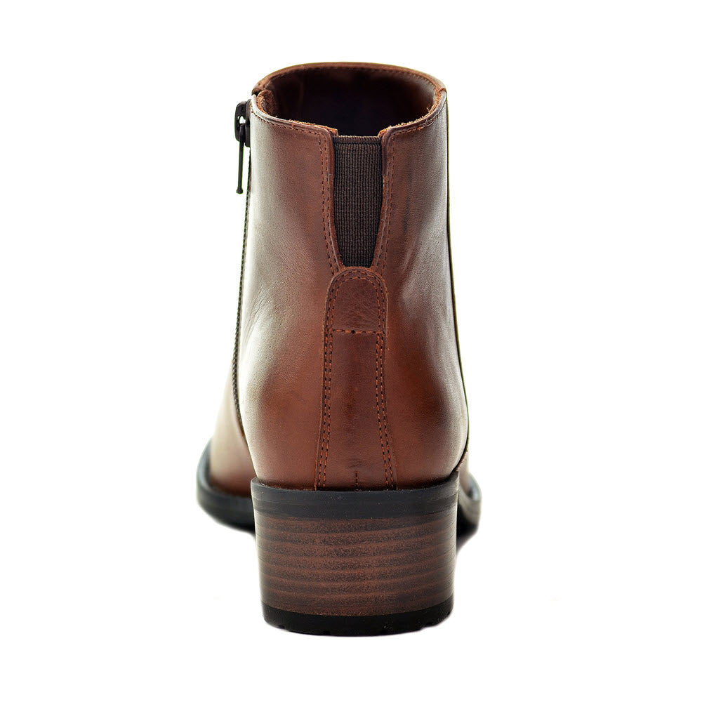 A rear view of a sleek and classic brown leather ankle bootie with a small heel and a side zipper, reminiscent of the timeless design of David Tate&#39;s DAVID TATE VOYAGE LUGGAGE - WOMENS.