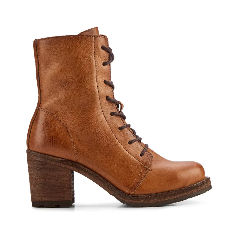 Introducing the Frye Karen Combat Caramel for women—a stylish tan buttery leather combat boot featuring a mid-height wooden block heel, detailed side stitching, and traction rubber insets designed for slip-free stepping.