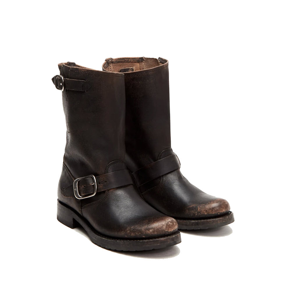 A pair of Frye Veronica Short distressed leather boots in black, featuring side buckles and showing signs of wear.