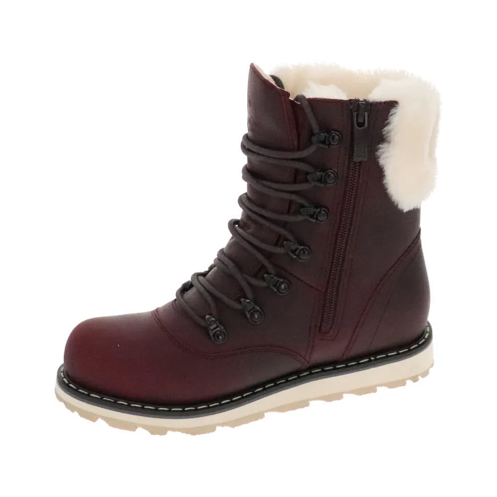 The Royal Canadian Cambridge Burgundy Winter Boot for women features black laces, a side zipper, white fur lining, and a thick white sole designed for cold weather. Made from waterproof leather and incorporating memory foam for added comfort.