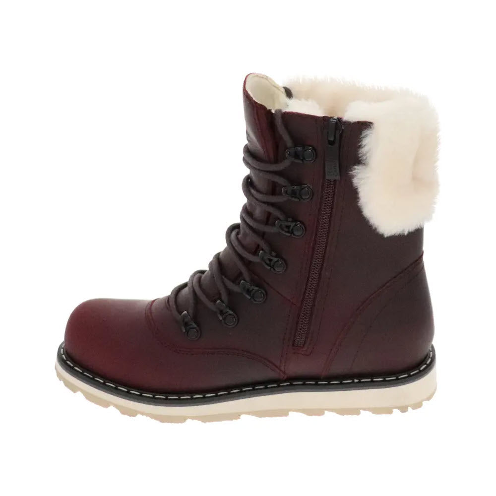 The ROYAL CANADIAN CAMBRIDGE BURGUNDY - WOMENS, a maroon winter boot by Royal Canadian, features black laces, a side zipper, and a luxurious white fur lining. Crafted from waterproof leather, it is showcased against a plain white background.