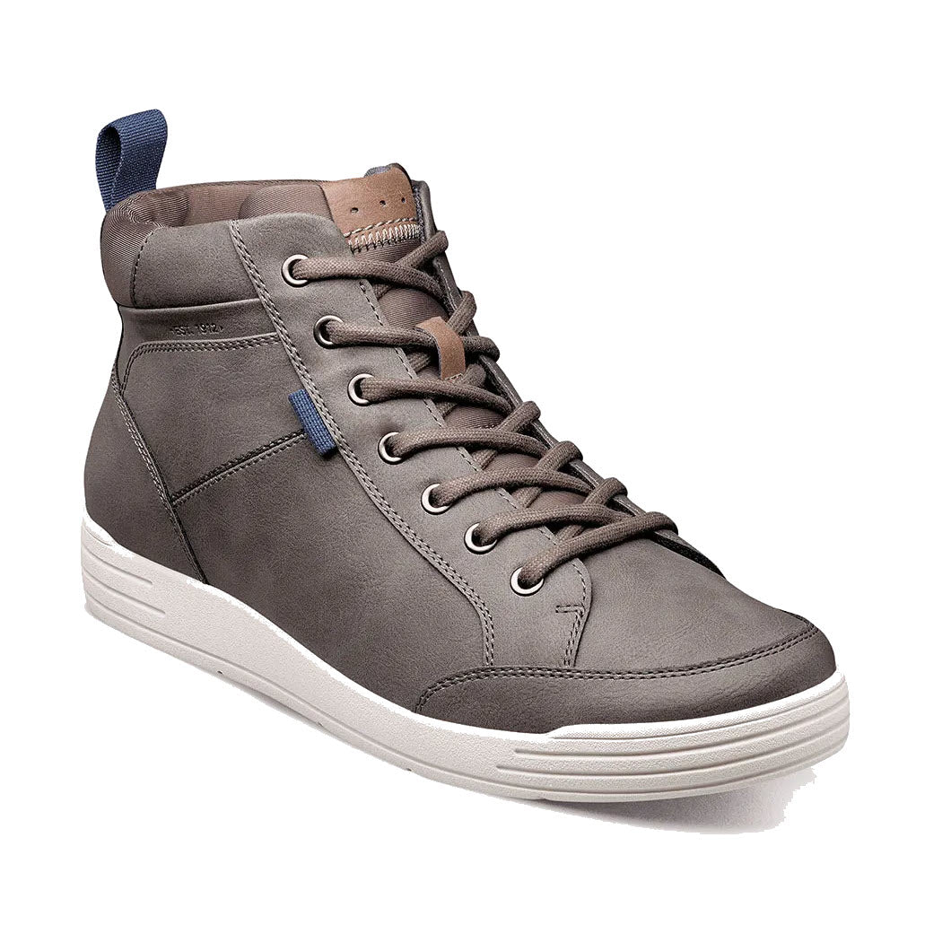 The Nunn Bush City Walk Moc Toe Chukka Gray for men combines retro-sneaker style with a single gray high-top sneaker featuring white soles, laces, a blue heel tab, and a brown tongue accent while ensuring modern comfort.