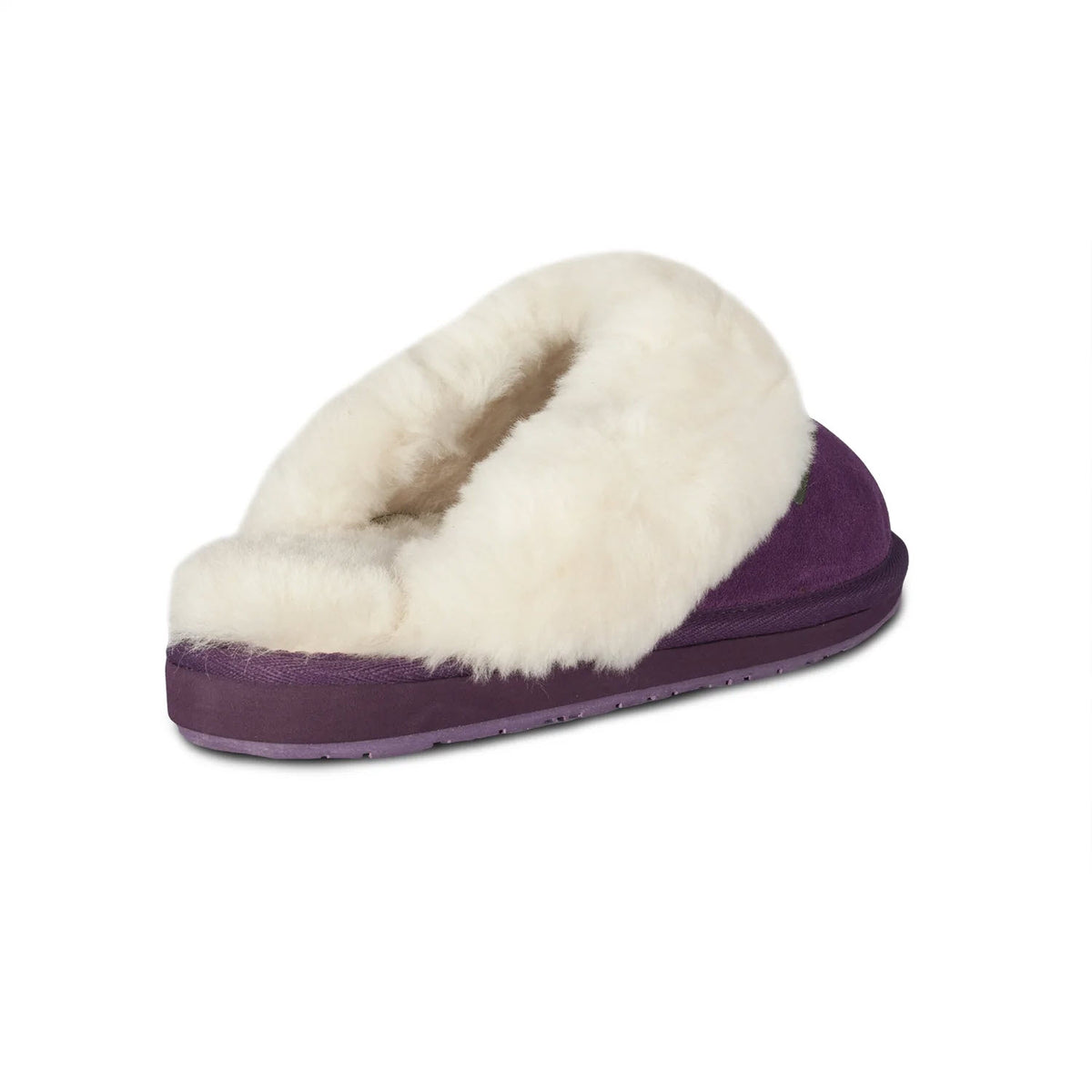 A purple slipper with a fluffy white lining, viewed from the side, offers the ultimate comfort. These Cloud Nine Ladies Scuff Purple slippers by Cloud Nine feature luxurious sheepskin, making every step feel like you&#39;re walking on air.