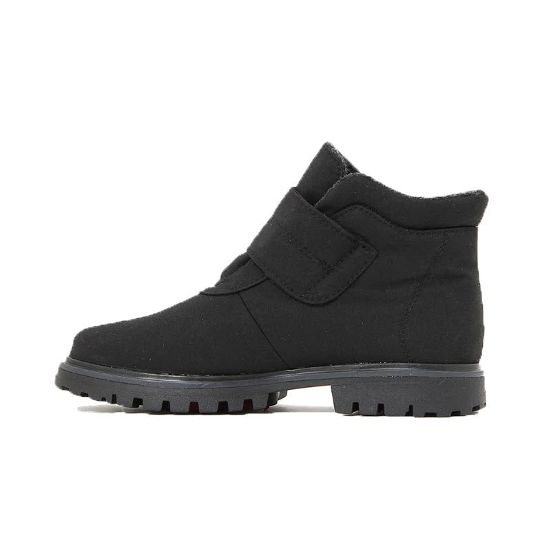 A black, ankle-high Toe Warmers Ava Flip Grip Boot for women with a rugged sole and a Velcro strap, perfect for winter style.