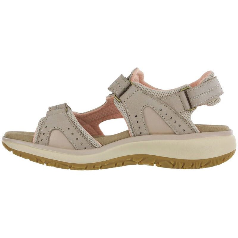 A SAS beige open-toe, outdoorsy sandal with multiple adjustable straps and a cushioned insole, viewed from the side.