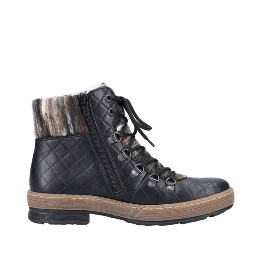 Side view of the RIEKER Yarn Cuff Lace Up Bootie in black leather, showcasing quilted patterns, a side zipper, gray laces, multi-colored fabric around the collar, and a brown rubber sole. These stylish winter ankle boots from Rieker feature a warm lining to keep you cozy in cold weather.