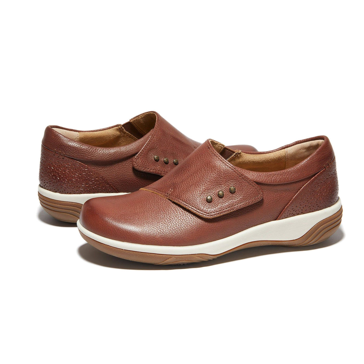 Introducing the Halsa Halsa Anna Dark Brown Light Sole for Women, a pair of stylish brown leather shoes featuring rich leather uppers, a side strap with buttons, and white and brown rubber soles.