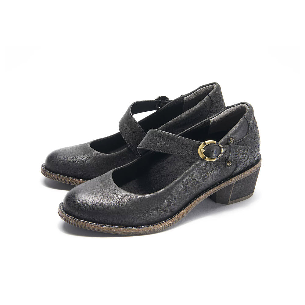 Introducing the HALSA MIA BLACK - WOMENS by Halsa, a pair of black heeled Mary Jane shoes featuring a soft leather upper, a strapped buckle, and a low chunky heel that embodies a retro-inspired silhouette.