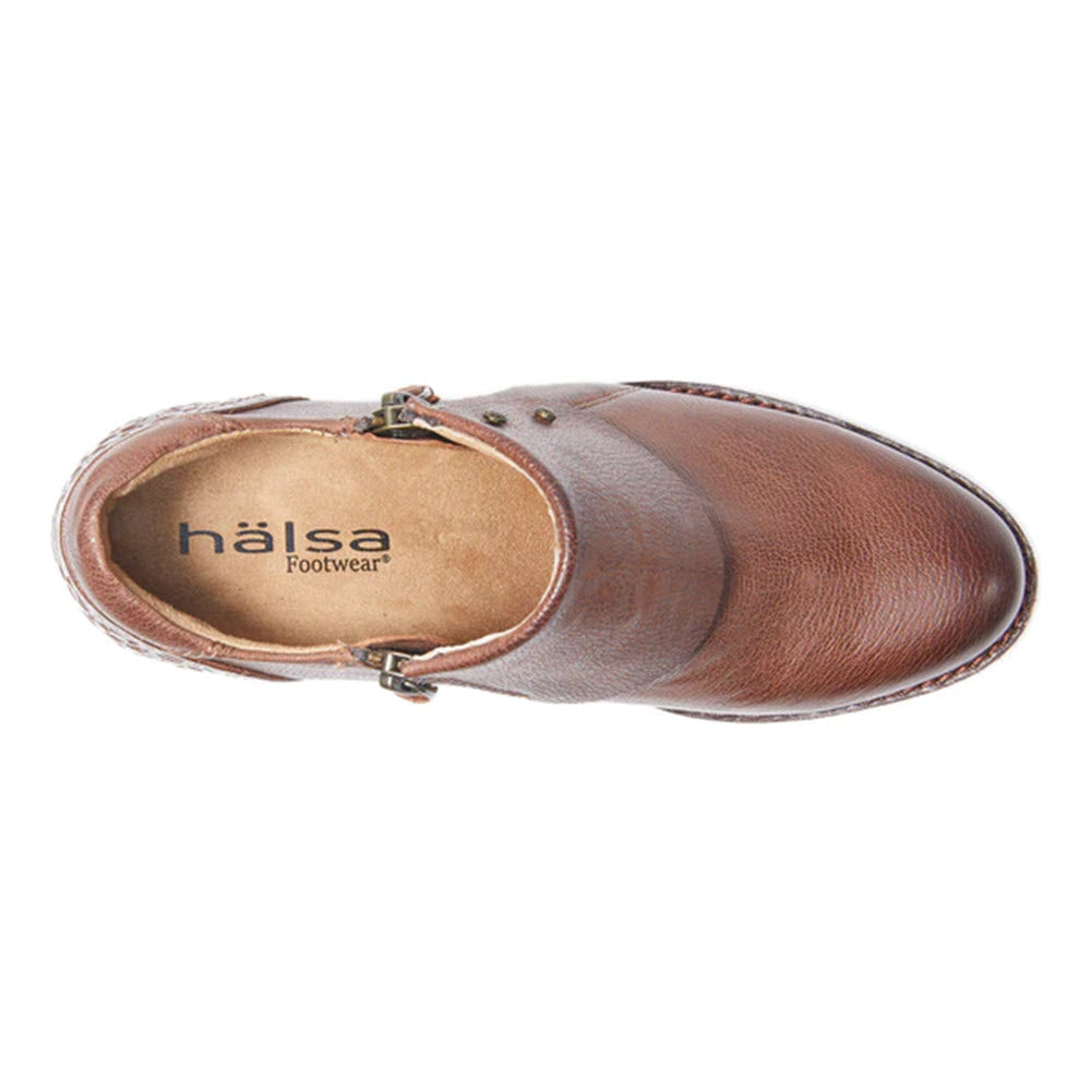 Top view of the HALSA Michelle Dark Brown women&#39;s shoe with a side buckle and the words &quot;Halsa Footwear&quot; on the insole, featuring hand-tooled leather for added elegance.