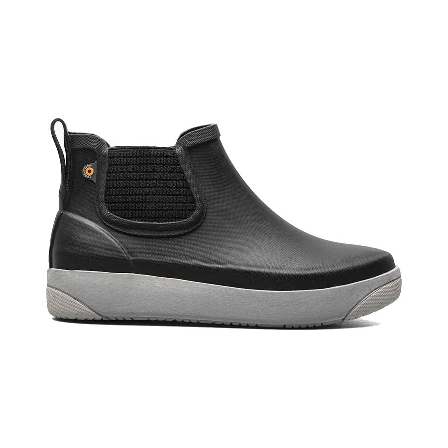 The BOGS KICKER RAIN CHELSEA II BLACK - WOMENS by Bogs is a functional slip-on shoe featuring a stylish black and gray high-top design, a textured elastic side panel, and a convenient pull tab at the back, making it perfect for everyday wear.