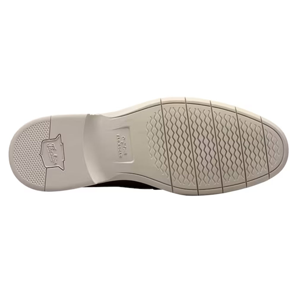 The image shows the bottom view of a versatile shoe sole, featuring a textured pattern for grip and &quot;Florsheim&quot; branding near the heel.