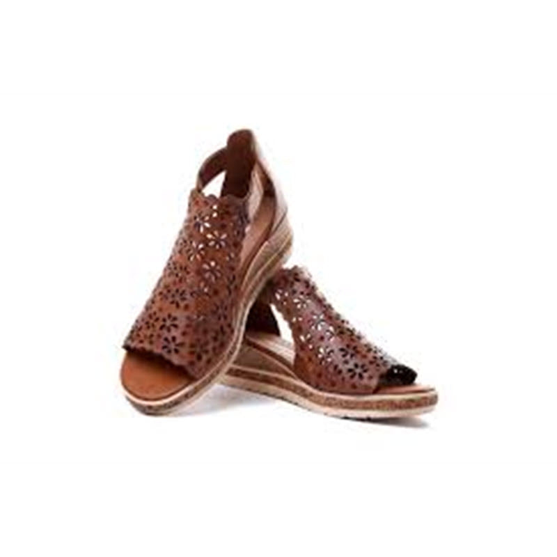 The REMONTE FLORAL PERFED WEDGE TAN - WOMEN&#39;S by Remonte features a pair of brown leather, floral cut-out, open-toe sandals with gladiator-style wedge heels and a shock-absorbing sole, displayed against a white background.