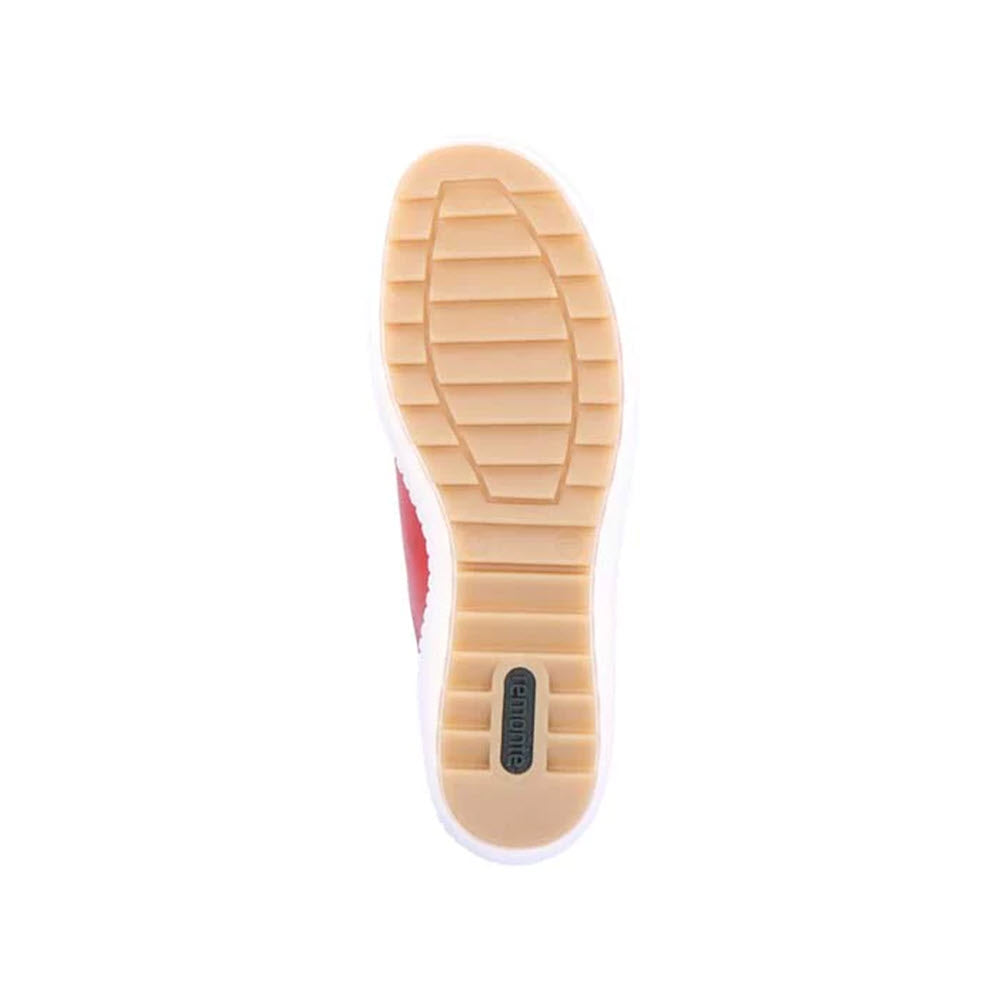 A close-up view of the stylish Remonte REMONTE EURO CITY WALKER FLAME - WOMENS red sneaker sole with a beige-colored tread pattern.