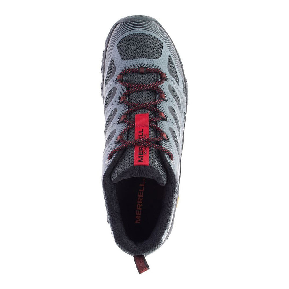 Top view of a grey and black Merrell MOAB 3 EDGE GRANITE - MENS hiking shoe with red and black laces, offering out-of-the-box comfort. The brand &quot;Merrell&quot; is visible on the tongue and insole.