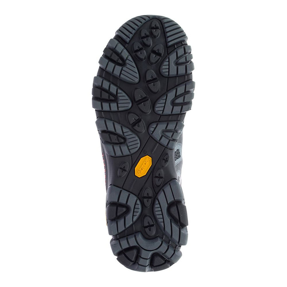 The image shows the sole of a black Merrell MERRELL MOAB 3 EDGE GRANITE - MENS hiking boot with a rugged tread pattern and an orange label in the center, designed for out-of-the-box comfort.