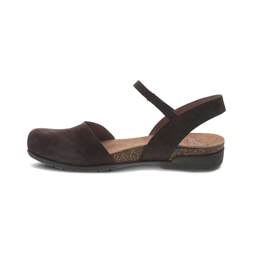 The DANSKO ROWAN CHOCOLATE - WOMENS from Dansko is a single dark brown flat shoe featuring a closed toe, an ankle strap with a buckle, and a cork insole. Perfect for a summer look, this hybrid sandal combines comfort and elegance reminiscent of the Dansko Rowan style.