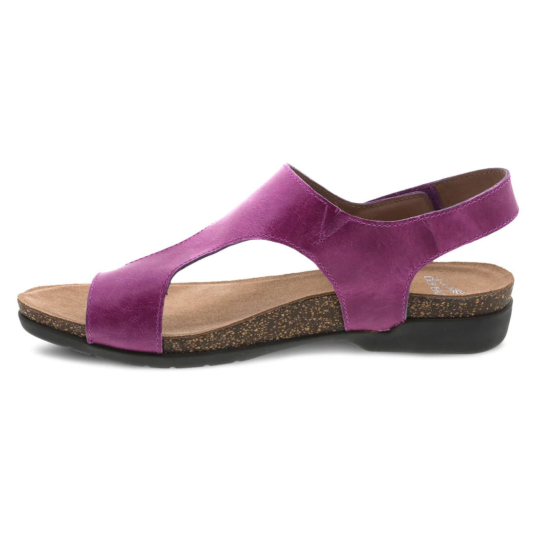 The DANSKO REECE MAGENTA - WOMENS from Dansko features a pink sandal with an open-toe design, a thick brown cork sole, a black rubber bottom, and a single adjustable back strap that wraps around the heel to ensure a perfect fit.