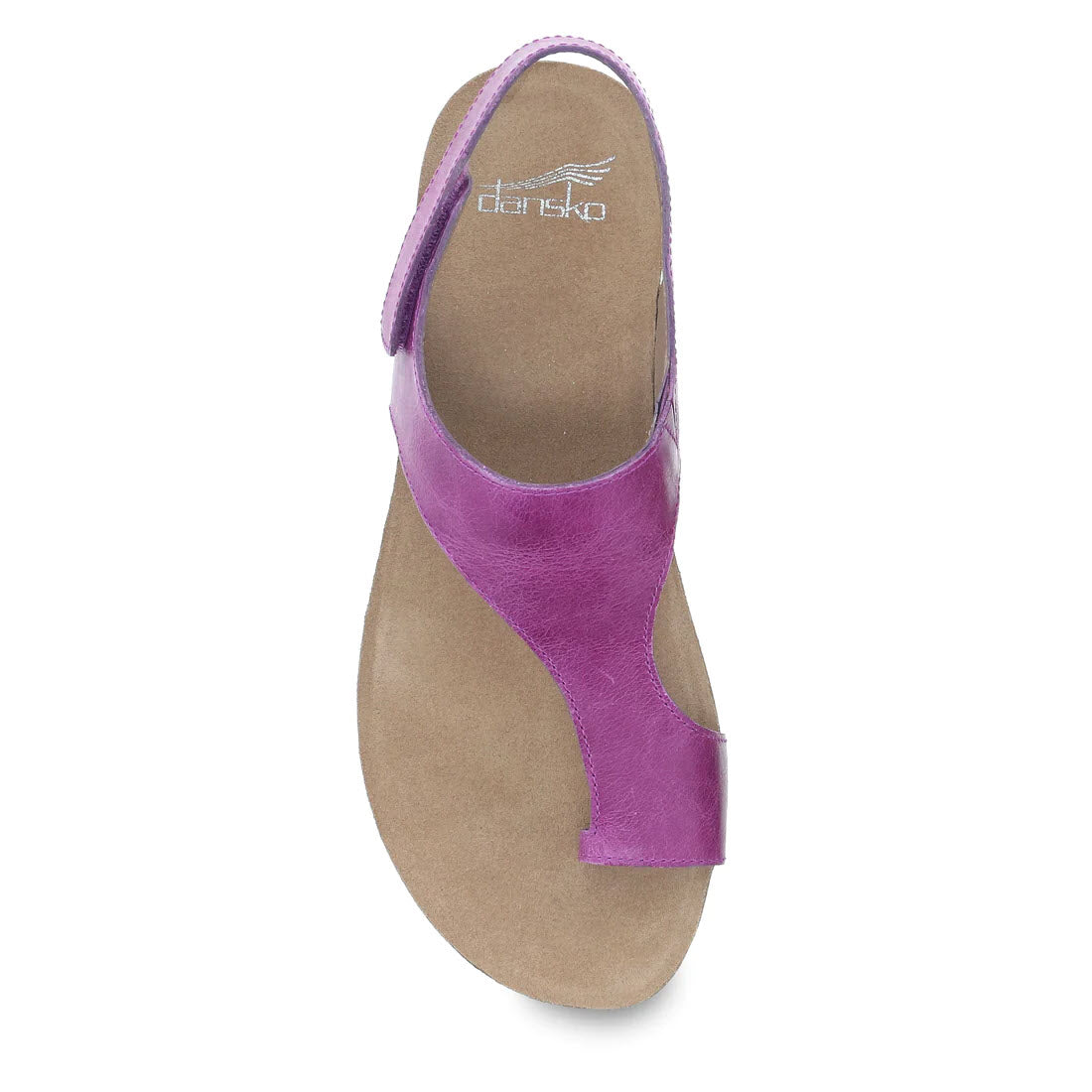 Top view of the Dansko Reece Magenta sandal for women, showcasing a casual leather design in purple with a cushioned beige sole, an adjustable back strap, and a comfortable toe loop.