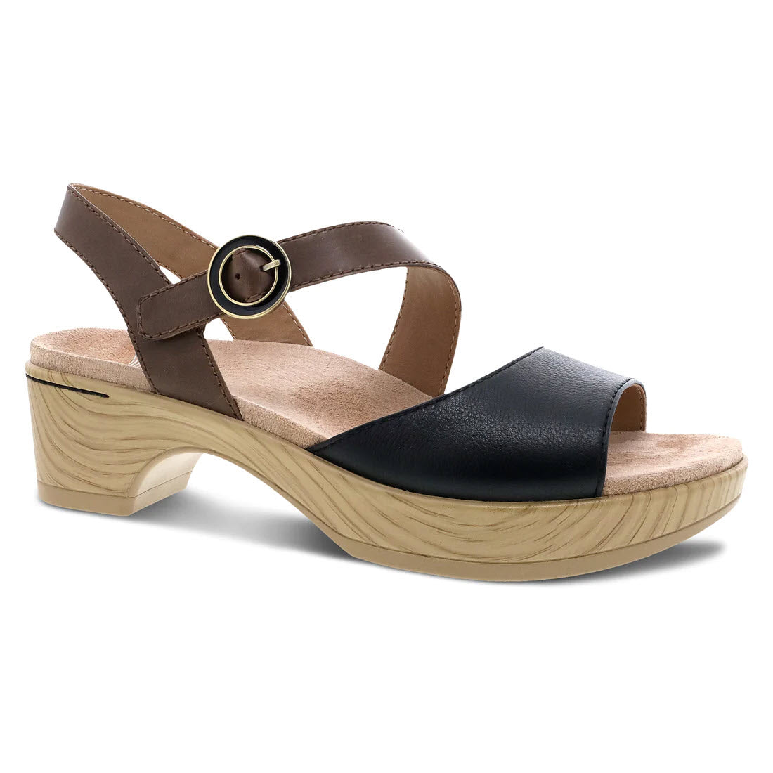 The DANSKO MARJORY BLACK NAPPA - WOMENS sandal by Dansko features leather uppers, a black toe strap, an asymmetrical brown ankle strap with a buckle, and a beige wedge heel.