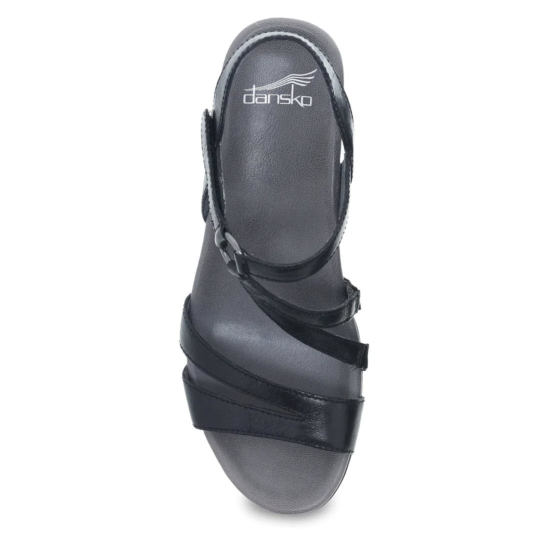 The DANSKO ADDYSON GLAZED BLACK - WOMENS is a single black wedge sandal with a closed heel and three crisscrossing straps over the toes. Crafted from chrome-free leather, it features a dark gray contoured EVA footbed, with the brand &quot;Dansko&quot; visible on the insole.