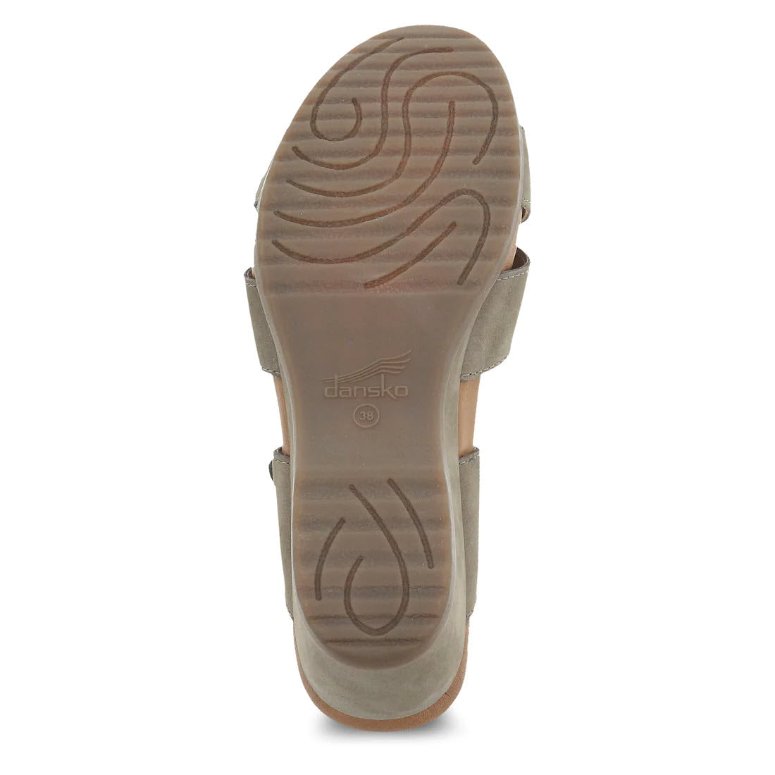 Bottom view of the Dansko Aubree Taupe Nubuck wedge sandal showcasing its sole with wave-like grooves and the Dansko logo embossed in the center. The nubuck uppers add a touch of elegance, while the leather-wrapped footbed ensures comfort with every step.