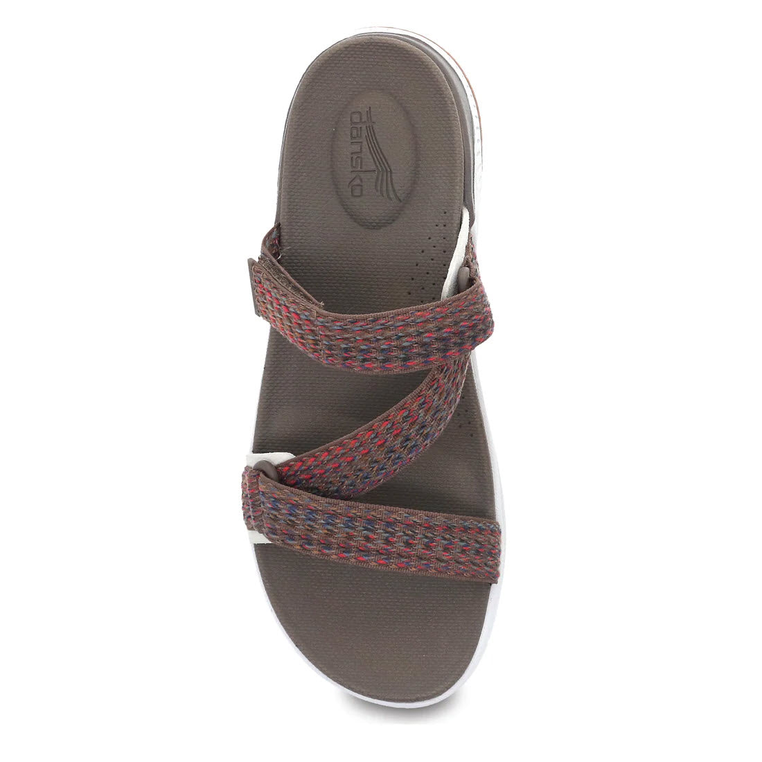 Top view of the Dansko Rosette Brown Multi sandal, showcasing two crisscrossing woven straps in shades of red and blue on a gray sole, blending the comfort of sandals with hints inspired by performance walking shoes.