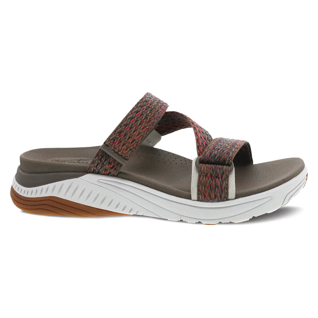 The DANSKO ROSETTE BROWN MULTI - WOMENS sandal by Dansko, featuring a brown and gray design, flat sole, white midsole, an adjustable strap over the toes, and a strap over the arch, offers legendary comfort.