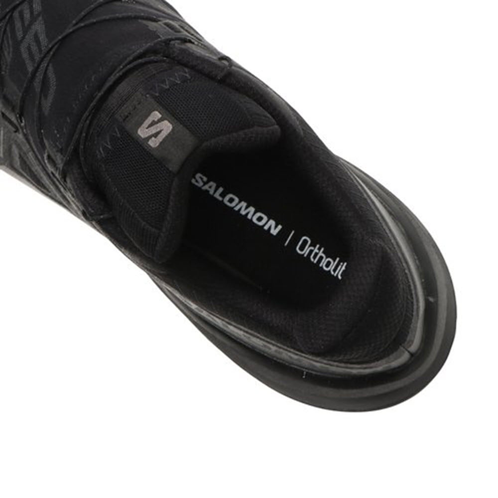 Close-up of the heel area of a SOLOMON SPEEDCROSS 6 GTX BLACK - WOMENS shoe by Salomon, featuring Ortholite insoles and waterproof Gore-Tex material.