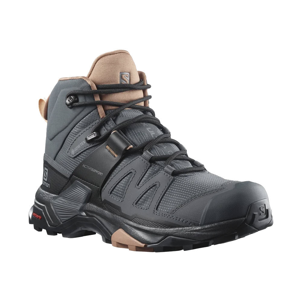 The SALOMON X ULTRA 4 MID GTX in EBONY/MOCHA MOUSSE/ALMOND CREAM for women by Salomon is a hiking boot that features GORE-TEX protection, a grippy outsole, rugged sole, and multiple laces.