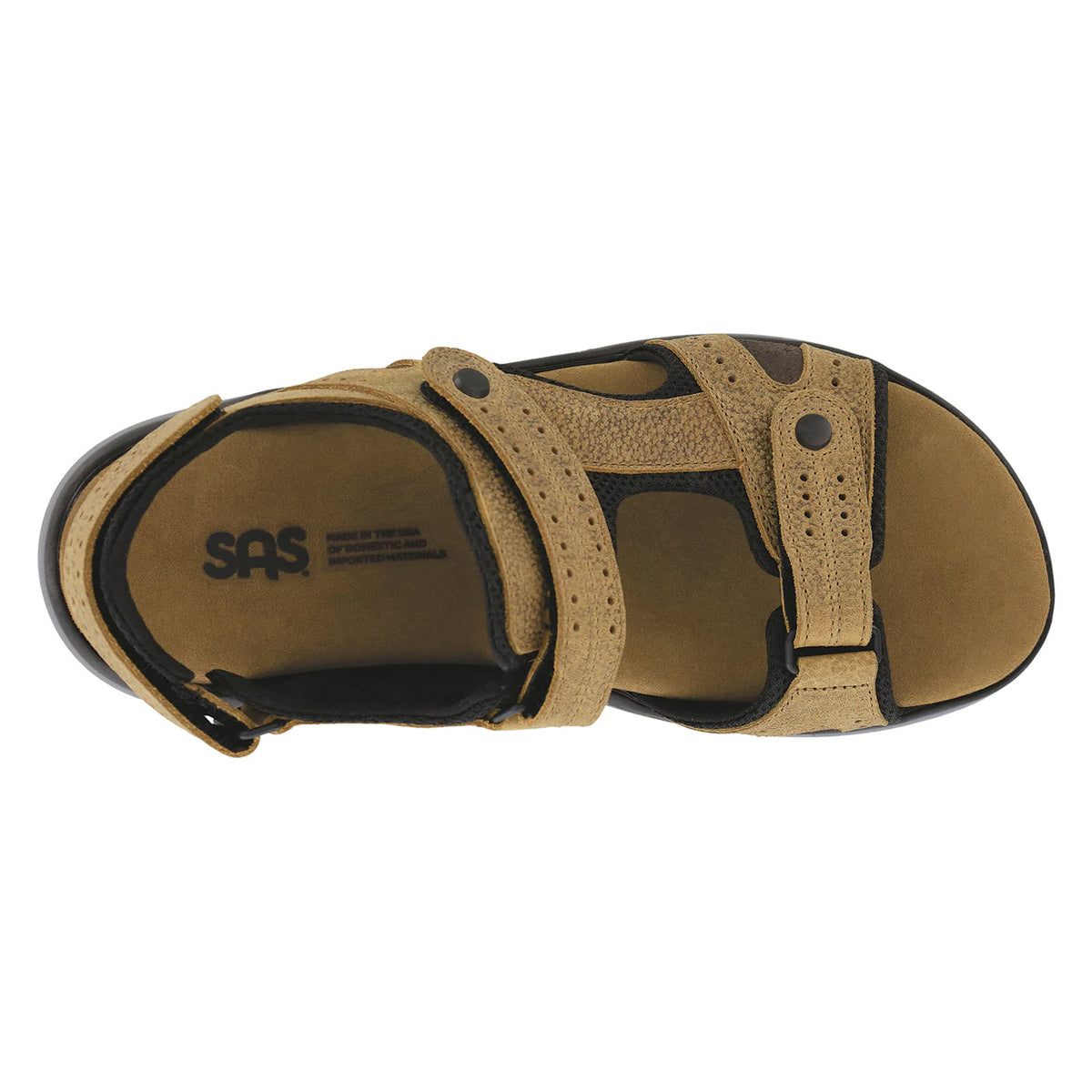 Top view of a tan SAS MAVERICK SANDAL STAMPEDE SAND - MENS with black accents, featuring adjustable straps and a visible &quot;SAS&quot; logo on the cushioned insole.