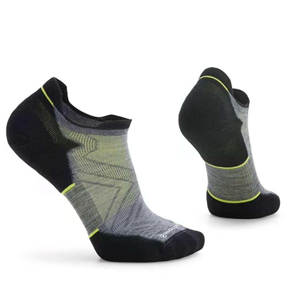Two pairs of Smartwool men&#39;s running socks, the SMARTWOOL RUN TARGETED CUSHION LOW ANKLE GREY, featuring a grey and black color scheme with neon yellow accents, displayed from different angles.