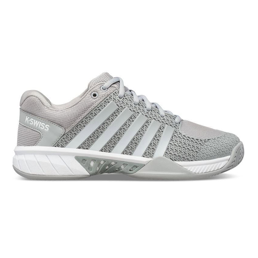 The K-SWISS EXPRESS LIGHT PICKLEBALL HIGHRISE GRAY - WOMEN&#39;S by K-Swiss is a grey athletic shoe with white accents, featuring a lightweight, breathable mesh upper, lace-up closure, durable outsole, and branded side panel and heel—ideal as a pickleball shoe.