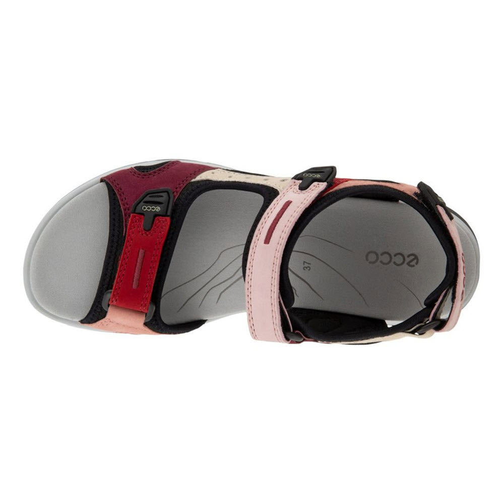 Overhead view of the ECCO OFFROAD Chili Red sandal for women, showcasing its vibrant colors, eye-catching adjustable Velcro straps, and closed-toe design, featuring a cushioned footbed for added comfort.