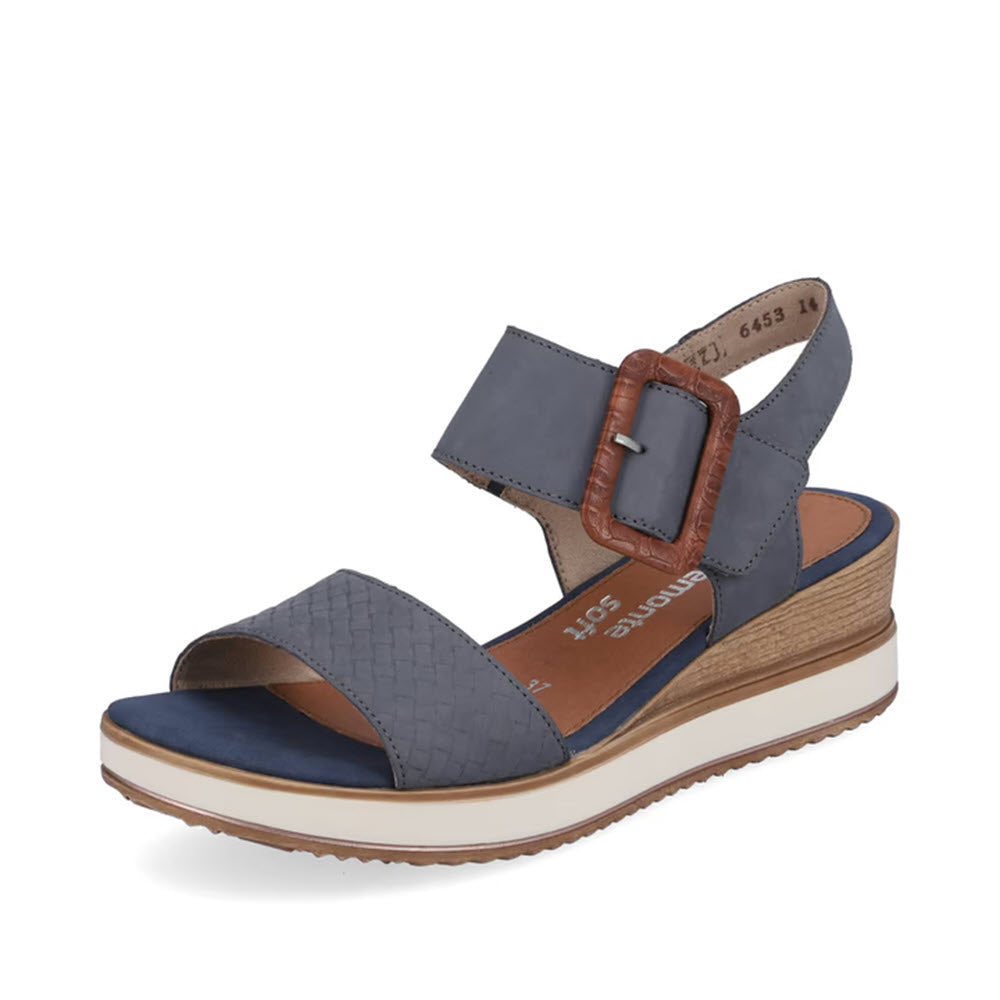 The REMONTE BIG BUCKLE WOVEN SANDAL JEANS for women by Remonte is a comfortable wedge sandal in denim blue, featuring a woven texture on the front strap, an adjustable buckle on the ankle strap, and a white ridged sole.