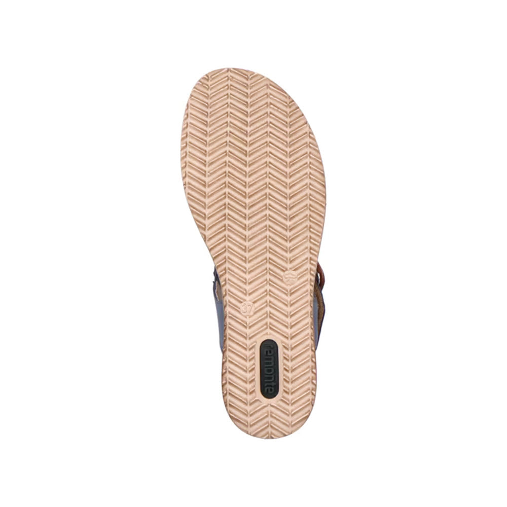 Bottom view of a single Remonte Remonte Big Buckle Woven Sandal Jeans for women showing a light tan sole with a herringbone pattern and the brand name &quot;Remonte&quot; on a small black tag near the arch.