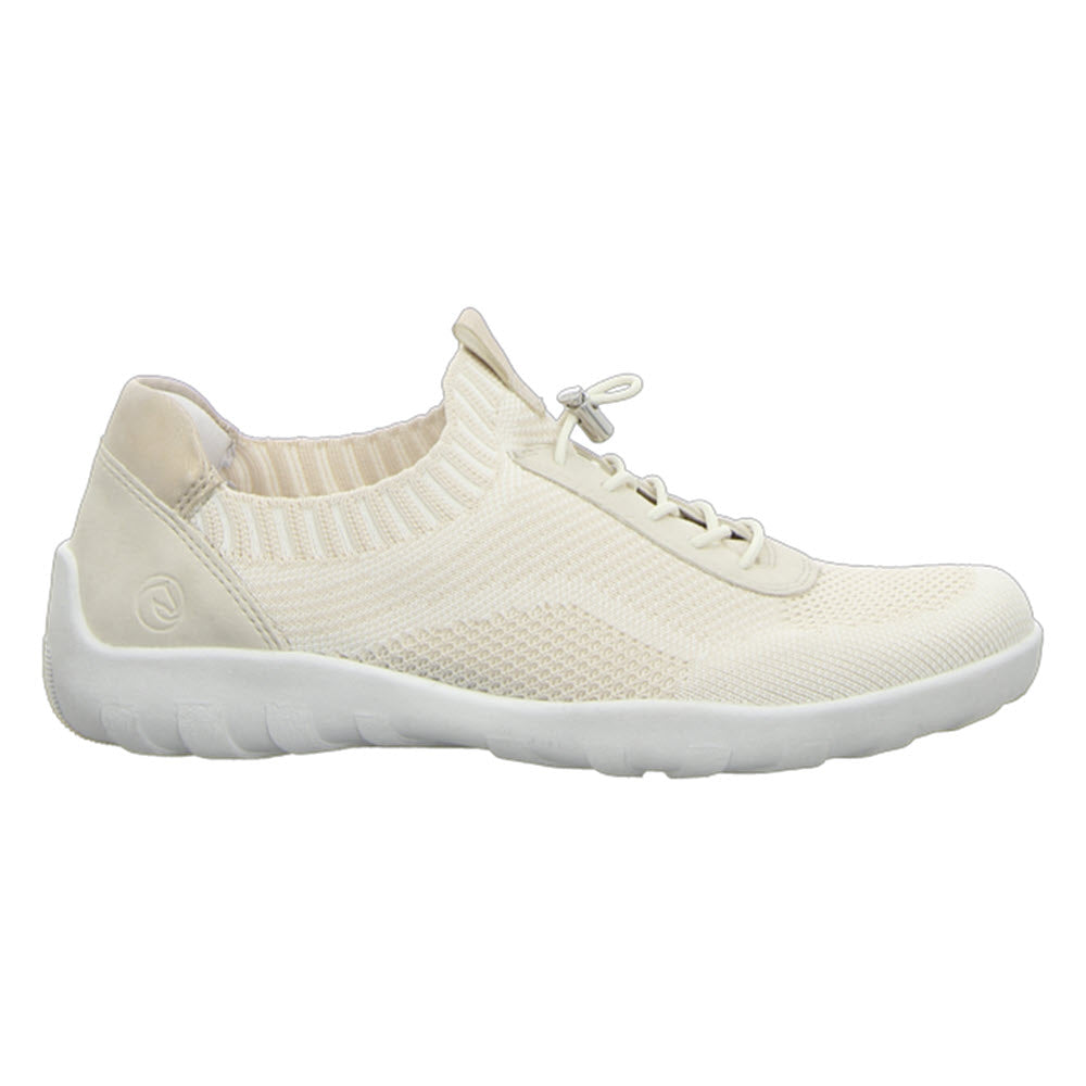 A beige athletic sneaker with a white rubber sole, knit fabric upper, and lace-up front. Lightweight and comfortable for everyday wear is the REMONTE LITE & SOFT SNEAKER VANILLA - WOMENS by Remonte.