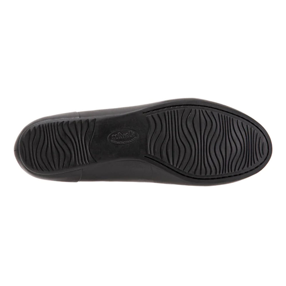 The image shows the outsole of a Softwalk Shiraz Black women&#39;s flat, featuring a textured rubber sole with wavy grooves for traction and a cushioned removable footbed.