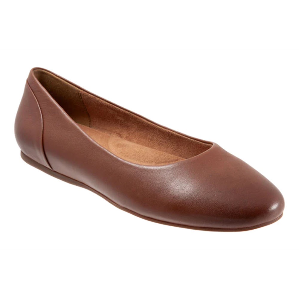 A single Softwalk Shiraz Cognac women&#39;s flat is shown. This brown leather shoe features a rounded, modern relaxed toe and a simple design. It appears new and includes a cushioned removable footbed for ultimate comfort.