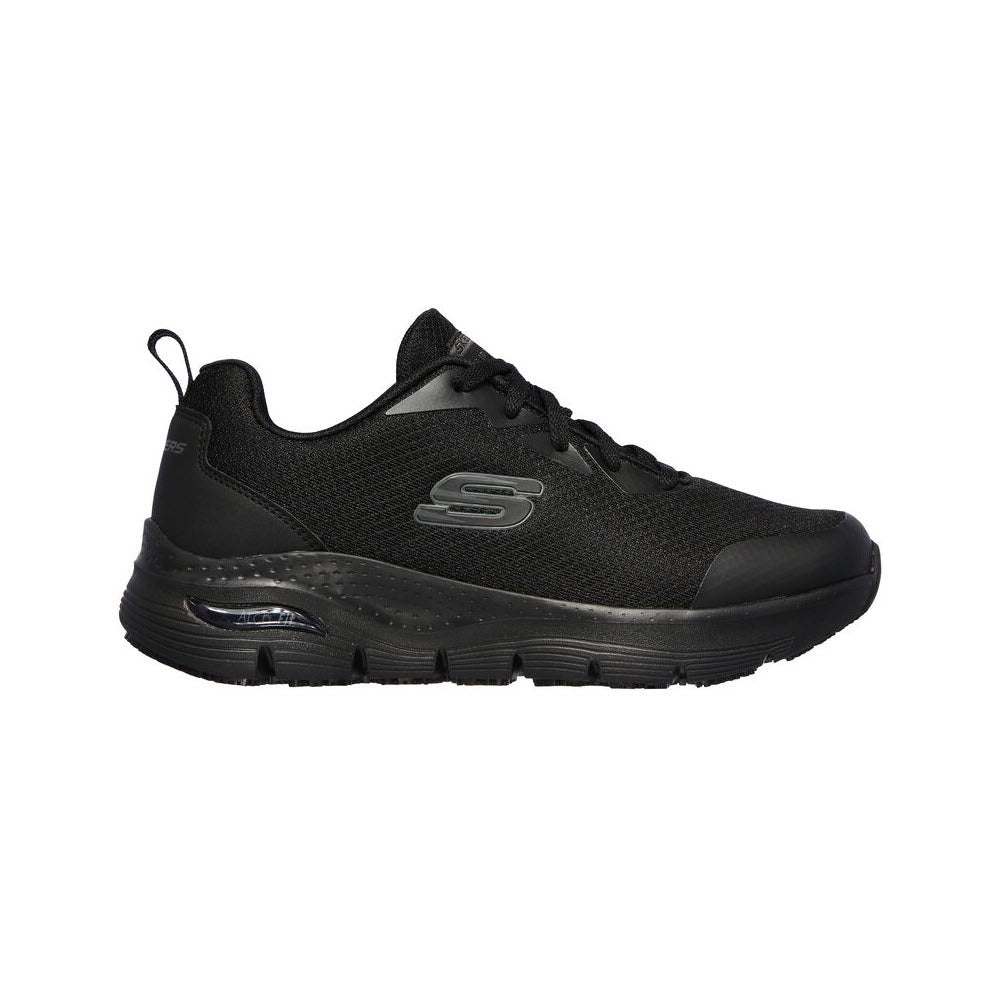 Side view of a black athletic sneaker featuring a mesh upper, cushioned sole with Arch Fit® support, and the letter &quot;S&quot; logo on the side. Product Name: Skechers Arch Fit Slip Resistant Oxford Black - Womens Brand Name: Skechers