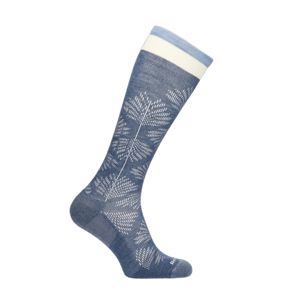 A single SOCKWELL FULL FLORAL DENIM 15-20MMHG sock by Sockwell, featuring a white leaf pattern design, with a white band at the top. The sock, ideal for wider calves, has a ribbed texture and reaches up to the calf.